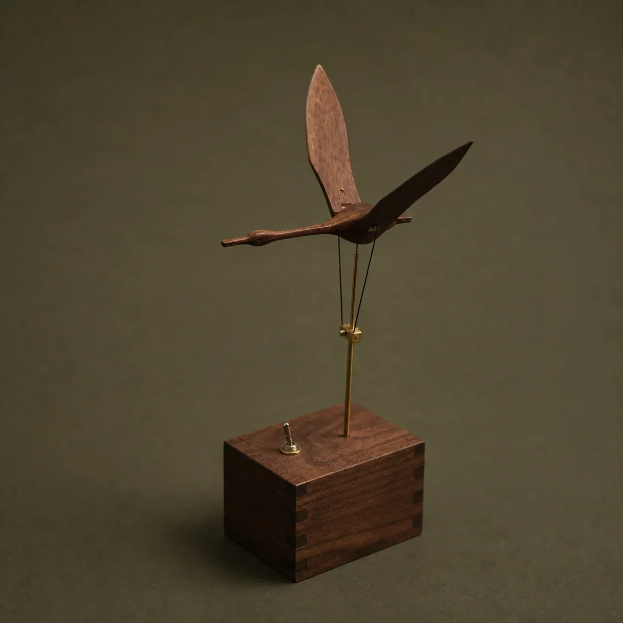 Flying Swan wooden kinetic sculpture shown from the front